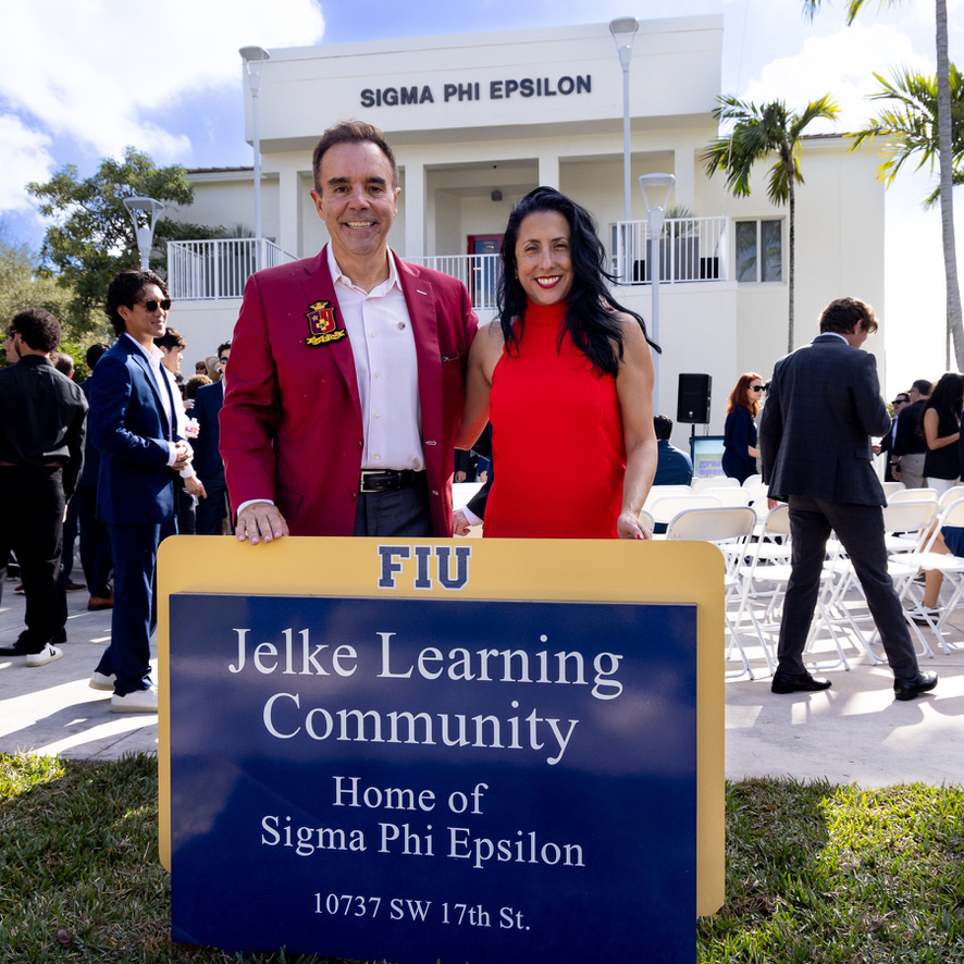 Thomas and Rebecca Jelke at the dedication, beside the Jelke Learning Community sign